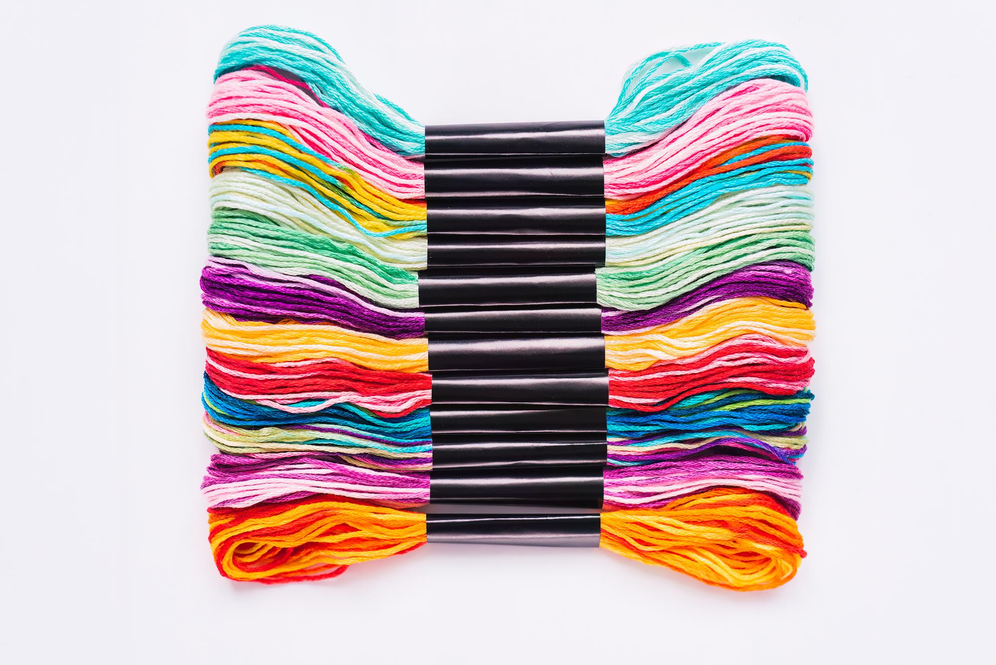 Close-up of embroidery kit with neon threads
